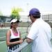 Greenhills No 2 singles player Anjali Purohit talks with her coach on Thursday, May 16. Daniel Brenner I AnnArbor.com